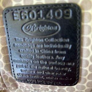 This cross body purse has been used & loved. Note the signs of use in pics.